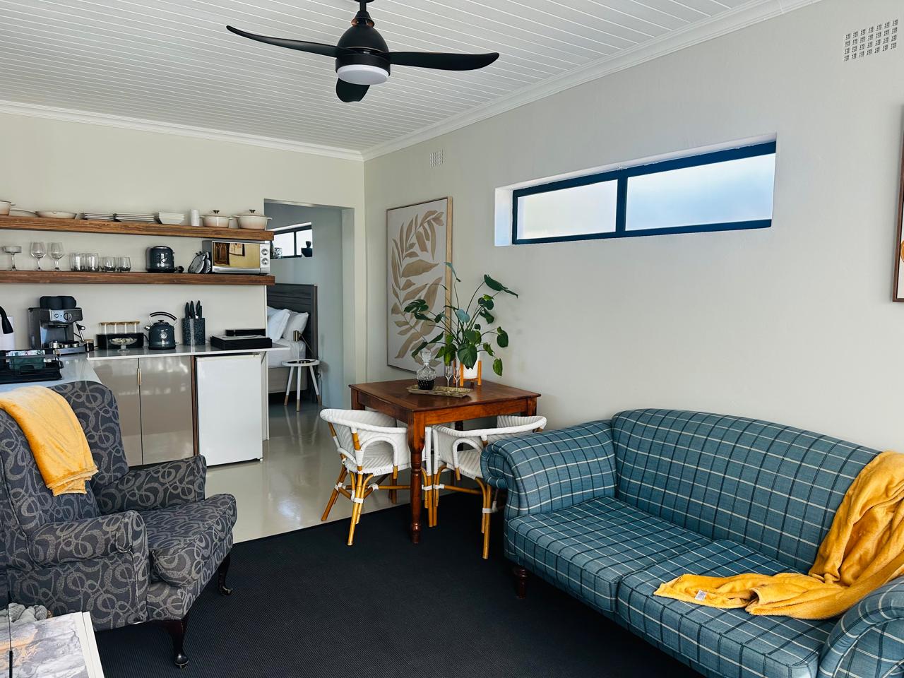 Full view of the lounge, dining area and kitchen